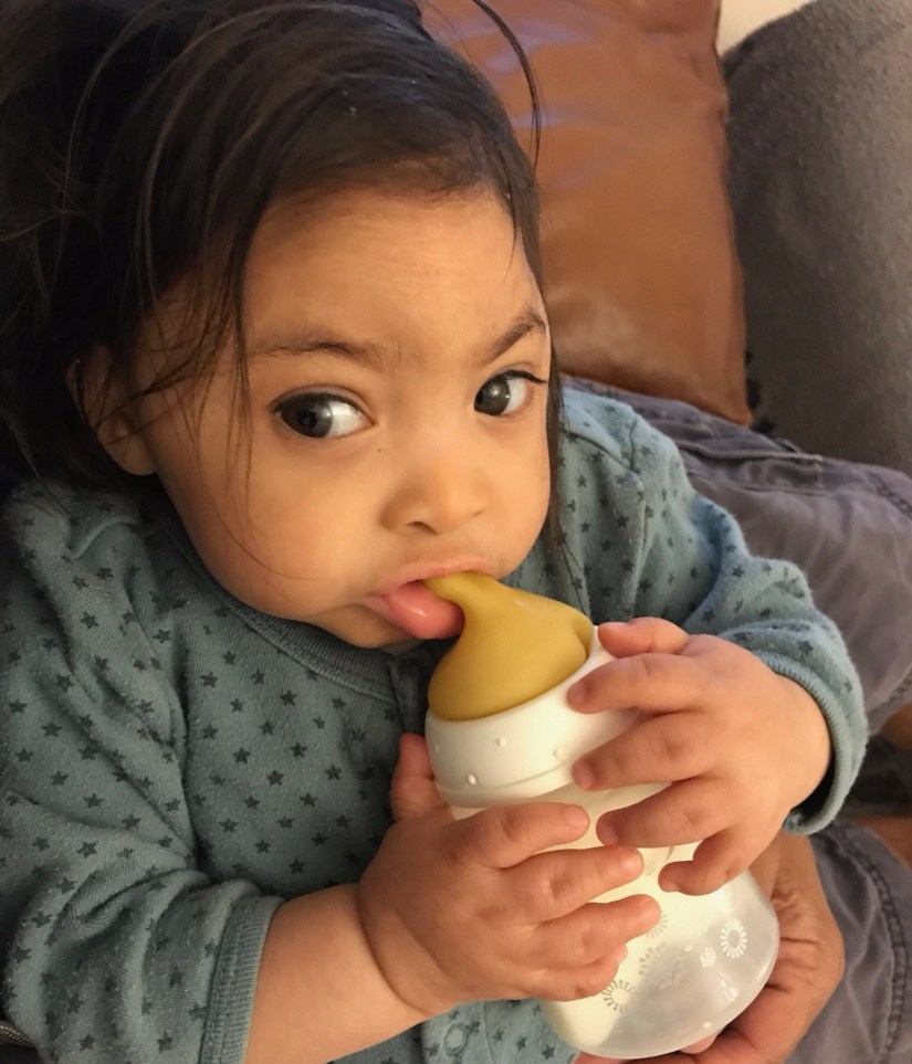 Aiya holding her bottle